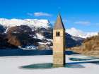The steeple of village Alt-Graun in Lake Reschensee, Val Venosta. Italy, Sudtirol, Alto Adige. Art Print